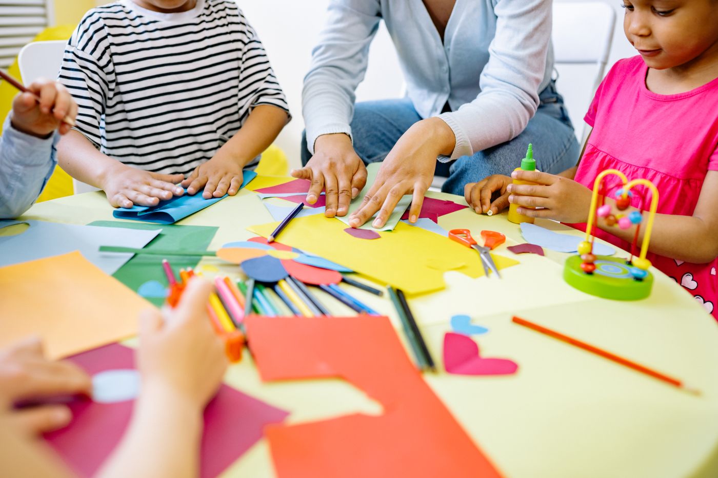 Elementary-age children enjoying a colorful creative activity together